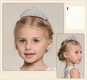 Detailed view of kids silver tiara featuring sparkling rhinestones and openwork design