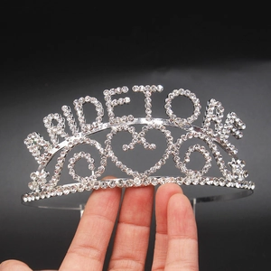 Detail of silver Bride To Be tiara with sparkling rhinestones and heart pattern