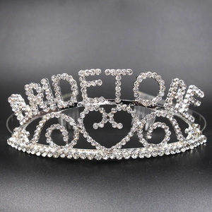 Detailed view of silver rhinestone tiara with BRIDE TO BE lettering and heart motif