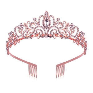 Macro detail of rose gold bridal crown featuring pear-cut crystal and side hair combs