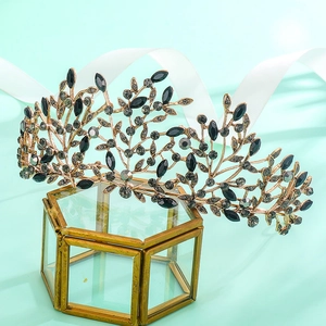 Detail of vintage gold alloy bridal crown with black rhinestones in leaf design