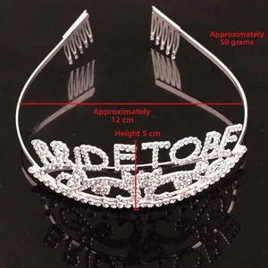Close-up of silver bride tiara with sparkling rhinestones, 12cm diameter and 5cm height