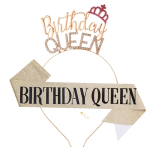 Close-up of Birthday Queen rose gold rhinestone tiara and glitter sash party accessories set