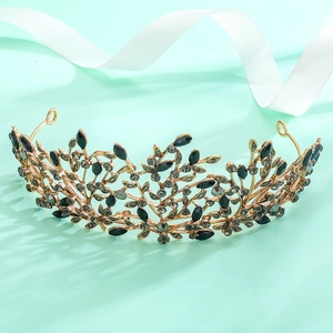 Detailed view of Baroque bridal tiara with black rhinestones on a mint background