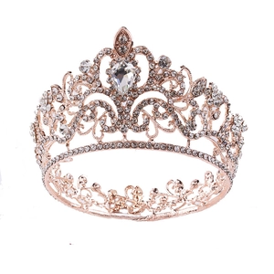 Macro detail of rose gold bridal crown with pear-cut crystal and pavé rhinestones