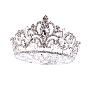 Macro detail of silver wedding crown showing sparkling rhinestones and crystal inlay