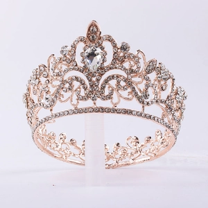 Macro detail of rose gold bridal crown featuring intricate teardrop crystal settings