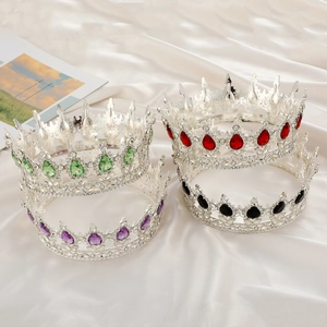 Detail of luxury bridal crowns in four colors on elegant white satin backdrop