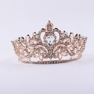 Macro detail of rose gold bridal crown featuring teardrop and round rhinestones