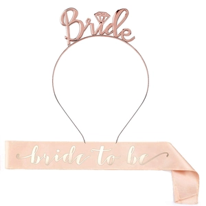 Detail of rose gold Bride headband and pink satin bride to be sash party decoration set