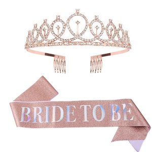 Detail showing rose gold rhinestone crown and pink glitter Bride To Be party sash