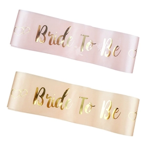 Detail of Bride To Be sash in pink and champagne satin with gold foil lettering