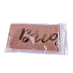 Rose gold glitter Bride To Be sash with gold safety pin in clear packaging for parties