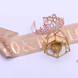 Detail of rose gold 50th birthday tiara with rhinestones and pink glitter fabulous sash