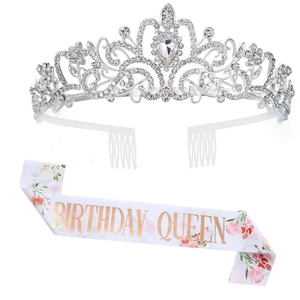 Close-up of birthday queen sash with pink floral print and silver rhinestone crown