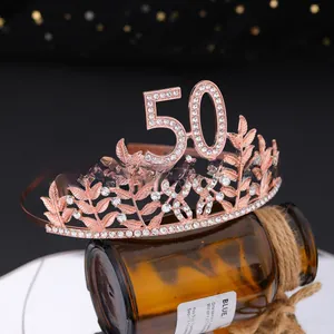 Detail view of rose gold 50th birthday tiara with rhinestones and elegant leaf design