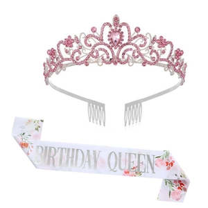 Close-up of birthday queen sash with floral print and pink rhinestone crown tiara set