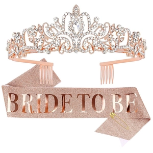 Close-up of rose gold rhinestone tiara and Bride To Be glitter sash with a safety pin