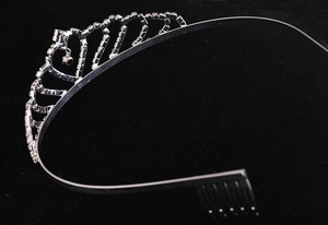 Macro view of silver bridal tiara with sparkling rhinestones and integrated hair combs