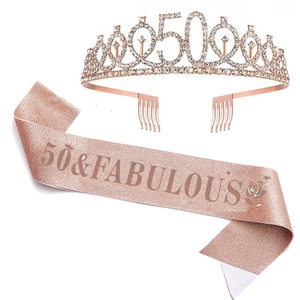 Close-up of rose gold 50th birthday tiara with rhinestones and 50 & Fabulous sash
