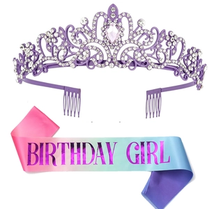Detail of glitter Birthday Girl sash and sparkling crystal tiara for party decoration
