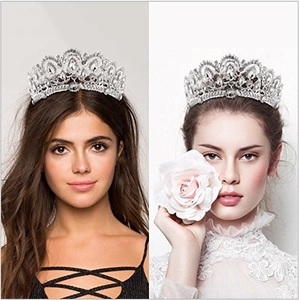 Detailed side view of luxury bridal tiara featuring sparkling rhinestones and pearls