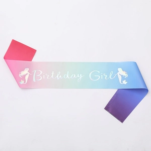 Detail of macaron gradient satin sash with Birthday Girl silver laser text and mermaid tail