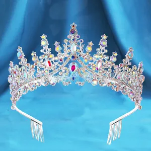 Detailed view of silver bridal crown with colorful rhinestones and integrated hair comb