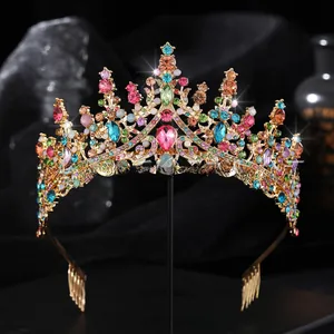 Macro shot of colorful rhinestones and pink heart gem on a golden bridal crown tiara