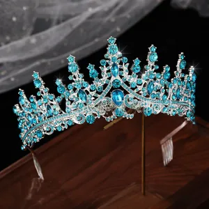 Close-up of vintage bridal crown with blue rhinestones and side hair combs for secure fit