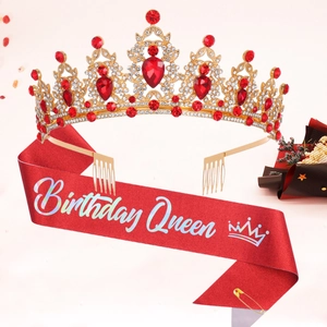 Close-up of glitter birthday sash and rhinestone tiara set with Birthday Queen text