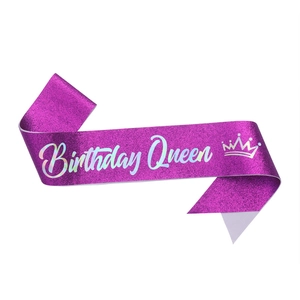 Glittery magenta Birthday Queen sash with white cursive text and crown for party decor