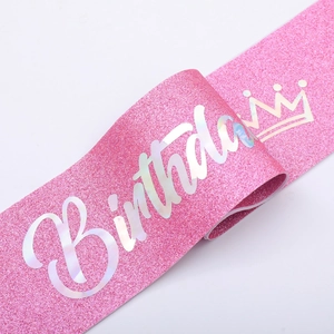 Pink glitter Birthday Girl sash with holographic lettering and crown decoration
