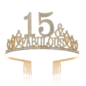 Close-up of golden rhinestone tiara with 15 and Fabulous lettering and dual hair combs