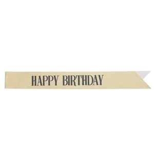 Close-up of champagne gold glitter sash with black Happy Birthday lettering and swallowtail cut