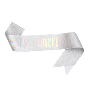Macro shot of silver sequined birthday sash featuring holographic Happy Birthday text