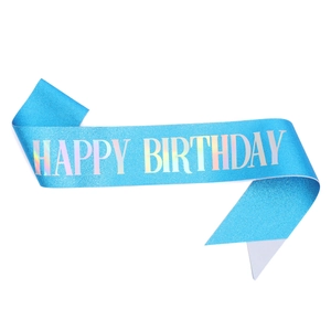 Close-up of blue sequin Happy Birthday sash with holographic silver lettering detail