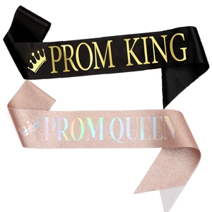 Detail of Prom King black satin and Prom Queen rose gold glitter sashes with gold lettering