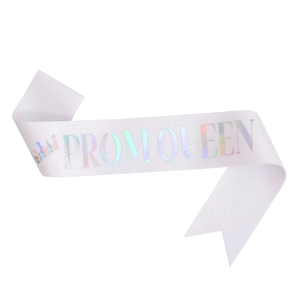 Detail of white glitter PROM QUEEN sash with holographic lettering and crown icon