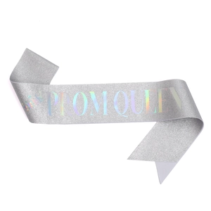 Detail of silver glitter Prom Queen sash with iridescent laser lettering and crown icon