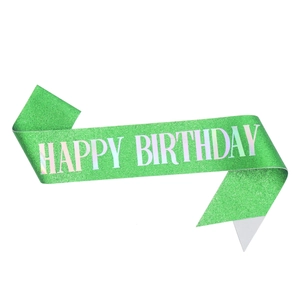 Close-up of green glitter Happy Birthday party sash with iridescent lettering details