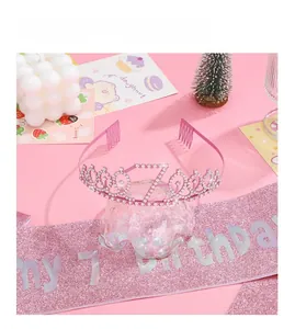 Pink birthday tiara with number 7 and sequin sash set against a decorative background