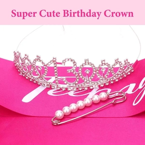 Detail of hot pink satin sash, rhinestone 13th crown, and pearl pin for birthday parties