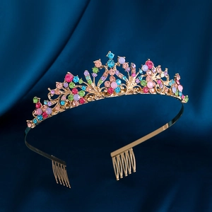 Detailed macro view of colorful rhinestones on a golden plum blossom bridal crown tiara