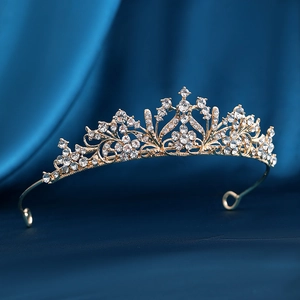 Golden bridal crown with sparkling crystal plum blossoms on elegant blue satin