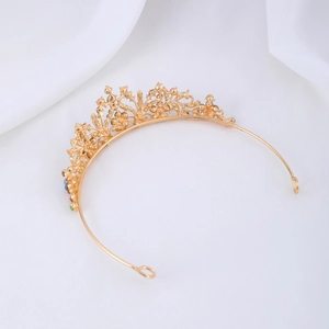 Close-up of golden alloy flower crown with colorful rhinestones and floral engravings
