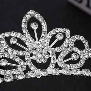 Elegant silver crown for girls featuring shimmering white diamonds and floral heart design