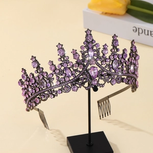 Detail of elegant tiara with purple rhinestones and dark metal base on display stand