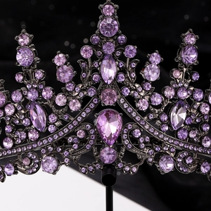 Macro shot of purple crystal crown detailing vintage black alloy base and intricate zircons