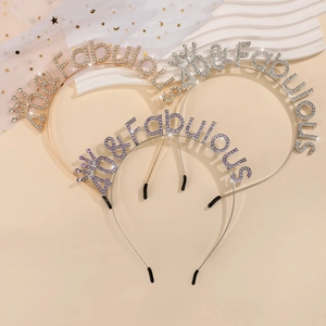 Three-piece set of 40 & Fabulous rhinestone tiaras in gold, silver, and purple finishes